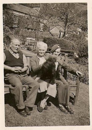 Morris McGarr, in uniform, with parents, Elizabeth and Morris John McGarr at YewBank - Clappersgate ( also JET - a black spaniel )