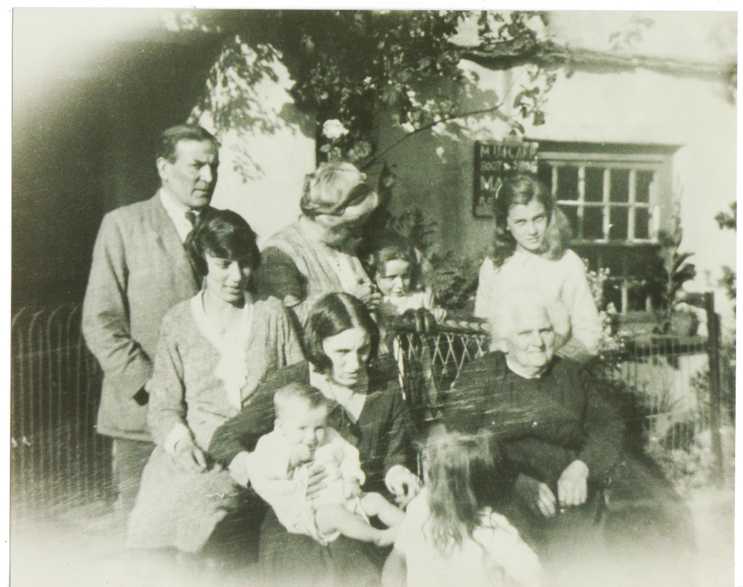 Mr & Mrs McGarr and family circa 1931 at Old Farm Cottage. The sign on the wall says M J McGarr Boot & Shoe Maker.
